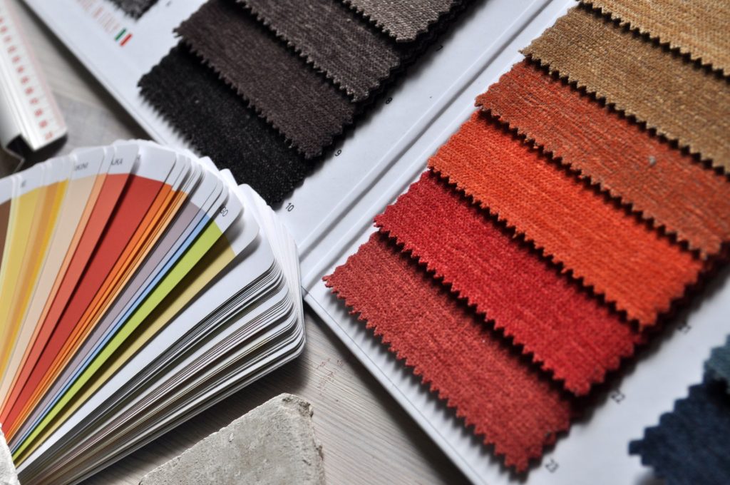 A fan of fabric swatches and colour samples