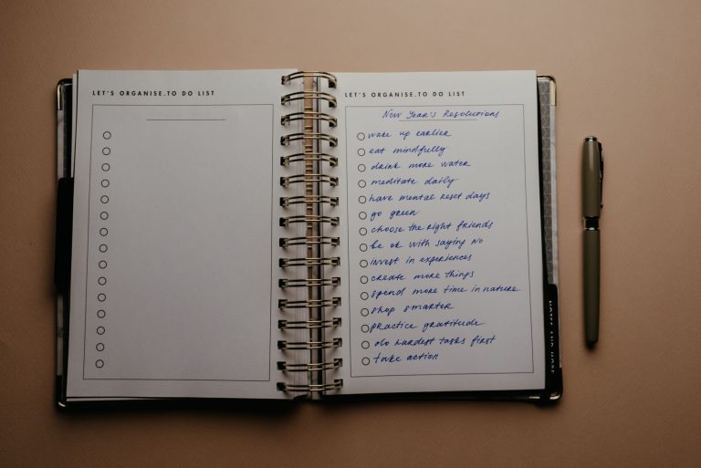 An open planner with a handwritten habit checklist
