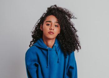 beautiful-curly-haired-girl-posing-in-a-blue-sweat-2025-02-11-23-55-44-utc.jpeg
